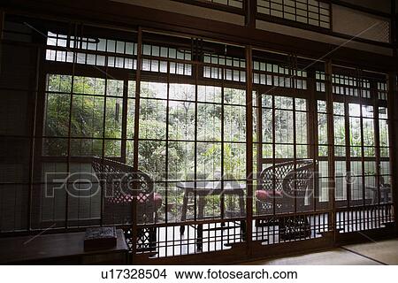 View of seating arrangement in a porch View Large Photo Image Picture - View of seating arrangement in a porch. Fotosearch