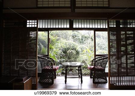 View of seating arrangement in a porch View Large Photo Image Stock Photo - View of seating arrangement in a porch. Fotosearch