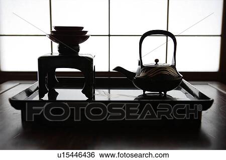 Stock Photograph - View of tea set on a table. Fotosearch