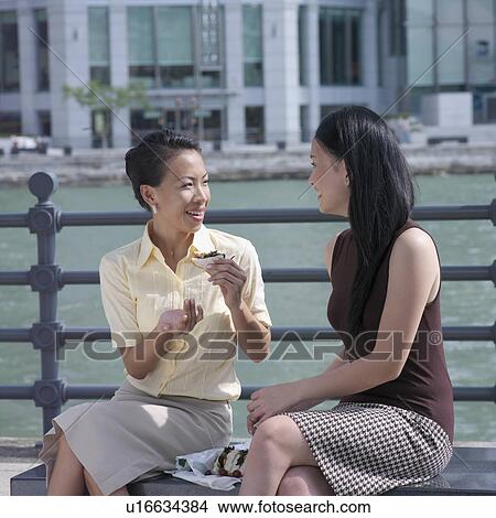 Picture - Two businesswomen looking at each other. Fotosearch