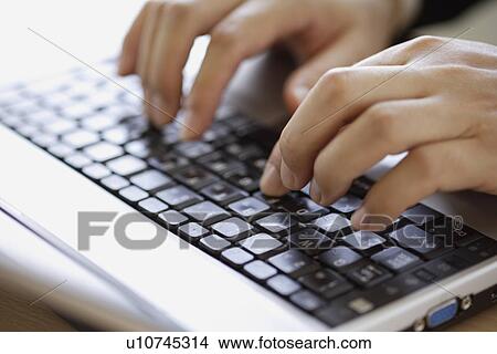A person typing on a keyboard View Large Photo Image Picture - A person typing on a keyboard. Fotosearch