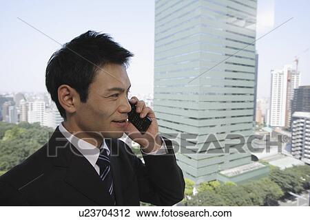Businessman talking on his cellphone, portrait View Large Photo Image Stock Image - Businessman talking on his cellphone, portrait. Fotosearch