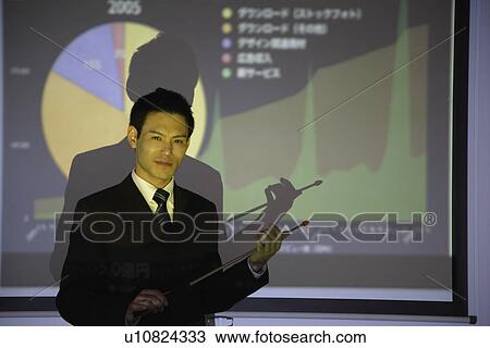 Businessman with a graphical representation View Large Photo Image Stock Image - Businessman with a graphical representation. Fotosearch