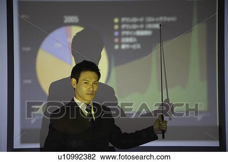 Businessman with a graphical representation View Large Photo Image Stock Image - Businessman with a graphical representation. Fotosearch