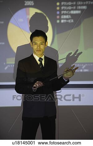 Businessman with a graphical representation View Large Photo Image Stock Image - Businessman with a graphical representation. Fotosearch
