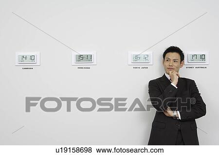 Businessman with time zones View Large Photo Image Stock Photo - Businessman with time zones. Fotosearch