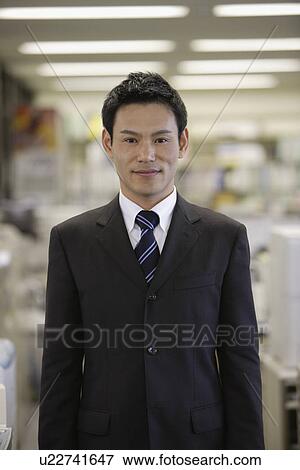 Stock Photo - Man smiling for the camera, portrait. Fotosearch