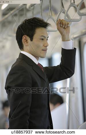 Stock Photo - Businessman traveling, portrait. Fotosearch