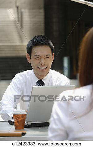 Stock Image - Businessman with his laptop. Fotosearch