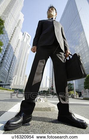 Picture - Low angle view of a businessman. Fotosearch