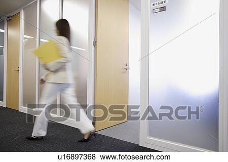 Stock Photo - Businesswoman moving out of her cabin. Fotosearch