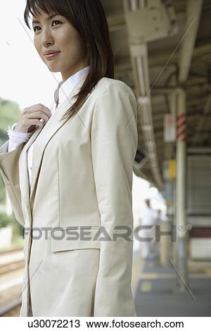Businesswoman at a railroad station, portrait View Large Photo Image Stock Image - Businesswoman at a railroad station, portrait. Fotosearch