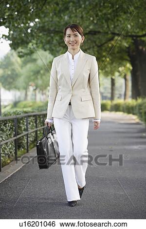 Front view of a professional woman View Large Photo Image Stock Photograph - Front view of a professional woman. Fotosearch