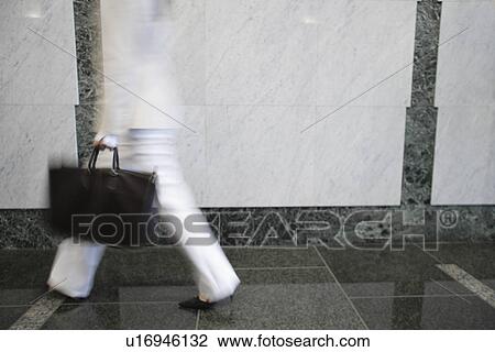 Midsection of a professional woman View Large Photo Image Stock Image - Midsection of a professional woman. Fotosearch