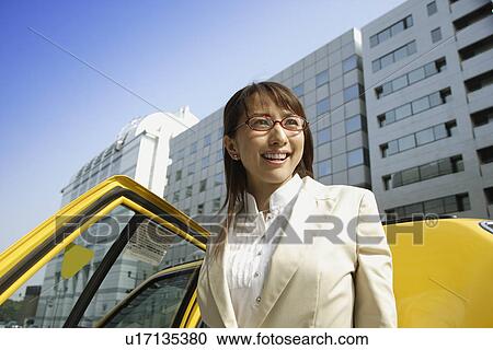 Woman near a car, portrait View Large Photo Image Stock Image - Woman near a car, portrait. Fotosearch
