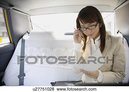 Stock Photo - Woman reading a diary, portrait. Fotosearch