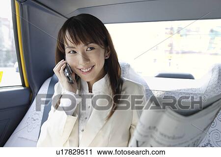 Woman talking on a cell phone, portrait View Large Photo Image Stock Image - Woman talking on a cell phone, portrait. Fotosearch