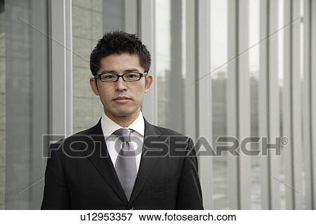 Stock Photo - Portrait of a young businessman. Fotosearch