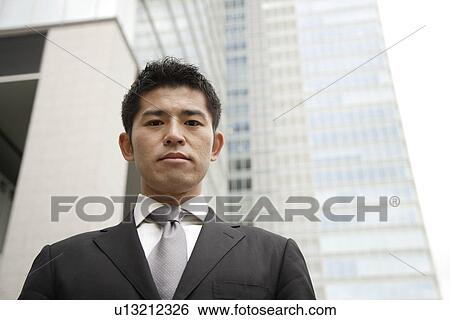 Portrait of a young businessman View Large Photo Image Stock Photograph - Portrait of a young businessman. Fotosearch