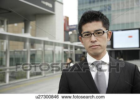 Stock Photograph - Portrait of a young businessman. Fotosearch