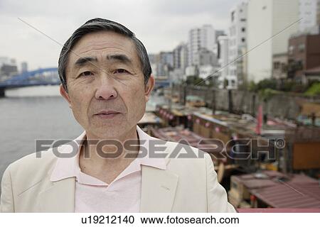 Stock Image - Close-up of a contemplative senior man. Fotosearch