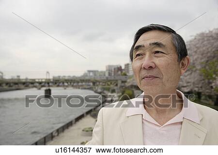 Stock Photo - Close-up of a senior man looking away. Fotosearch