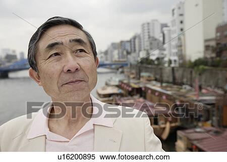 Stock Photography - Close-up of a senior man looking away. Fotosearch