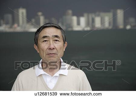 Stock Photo - Portrait of a serious man. Fotosearch
