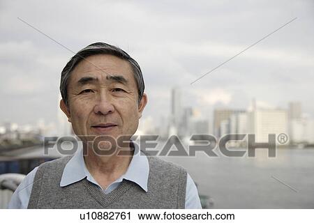 Stock Image - Portrait of a smiling senior man. Fotosearch