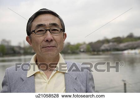 Stock Photo - Portrait of serious senior man. Fotosearch