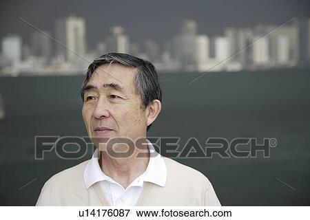 View of a senior man looking away View Large Photo Image Stock Photo - View of a senior man looking away. Fotosearch