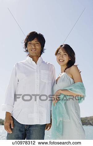 Stock Image - Husband and wife standing together. Fotosearch