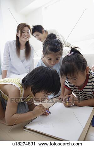 A young couple with three children View Large Photo Image Stock Image - A young couple with three children. Fotosearch