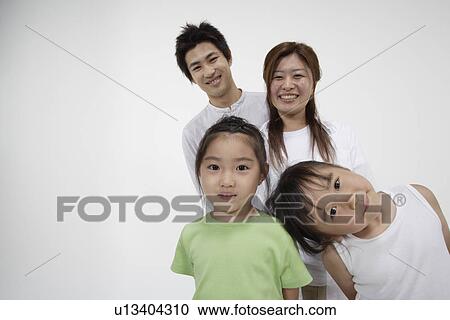 A young couple with two girls View Large Photo Image Stock Image - A young couple with two girls. Fotosearch