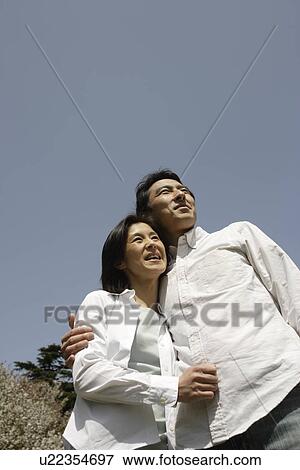 A young couple smiling View Large Photo Image Stock Photo - A young couple smiling. Fotosearch