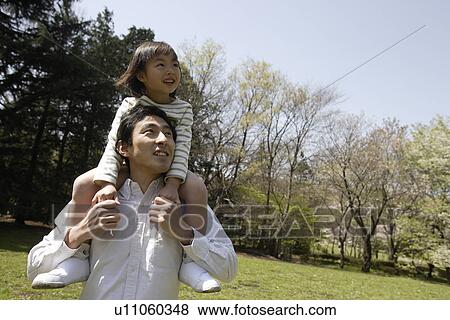 Father carrying daughter View Large Photo Image Stock Photo - Father carrying daughter. Fotosearch