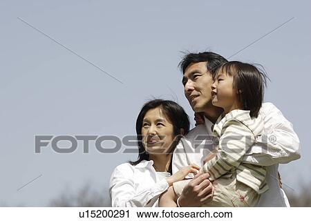 Parents smiling with daughter View Large Photo Image Stock Image - Parents smiling with daughter. Fotosearch