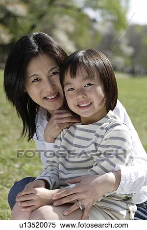 Portrait of mother and daughter smiling View Large Photo Image Stock Photography - Portrait of mother and daughter smiling. Fotosearch