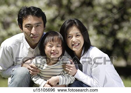 Portrait of parents smiling with daughter View Large Photo Image Stock Photograph - Portrait of parents smiling with daughter. Fotosearch