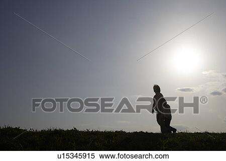 Silhouette of a mother and daughter walking View Large Photo Image Stock Photography - Silhouette of a mother and daughter walking. Fotosearch