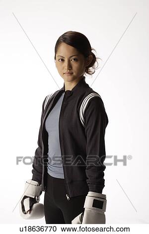 Portrait of a young woman with boxing gloves View Large Photo Image Stock Image - Portrait of a young woman with boxing gloves. Fotosearch