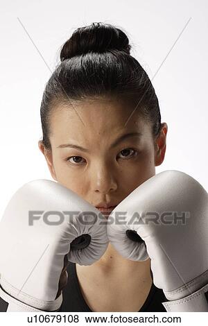 Portrait of a young woman with boxing gloves View Large Photo Image Stock Photo - Portrait of a young woman with boxing gloves. Fotosearch