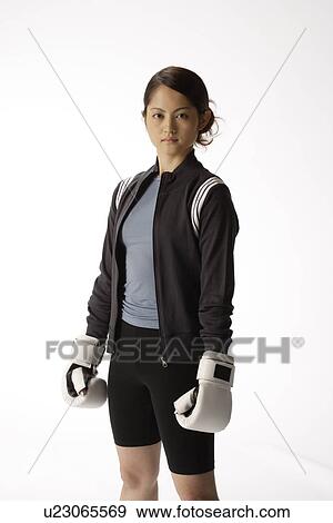 Portrait of a young woman with boxing gloves View Large Photo Image Stock Photo - Portrait of a young woman with boxing gloves. Fotosearch