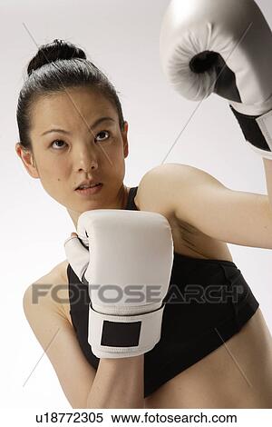 Portrait of a young woman with boxing gloves View Large Photo Image Stock Photography - Portrait of a young woman with boxing gloves. Fotosearch