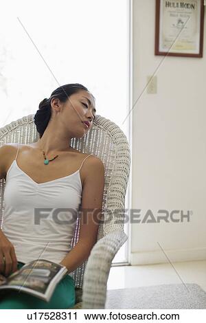A young woman sleeping on chair View Large Photo Image Stock Image - A young woman sleeping on chair. Fotosearch