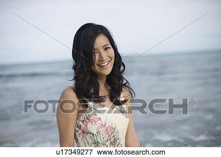 Stock Photo - A woman smiling. Fotosearch
