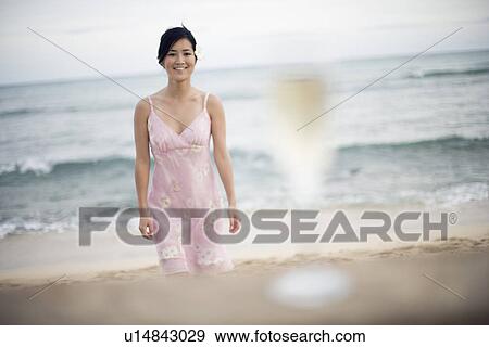 A woman strolling in beach View Large Photo Image Stock Photo - A woman strolling in beach. Fotosearch