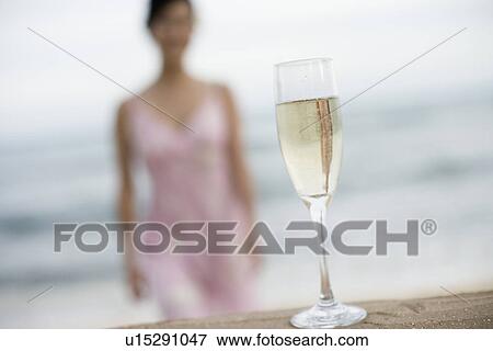 Close-up of wineglass filled with alcoholic beverage View Large Photo Image Stock Photo - Close-up of wineglass filled with alcoholic beverage. Fotosearch