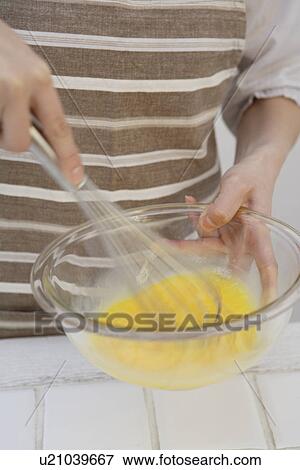 View of hands mixing egg yolk with whisk View Large Photo Image Stock Photo - View of hands mixing egg yolk with whisk. Fotosearch