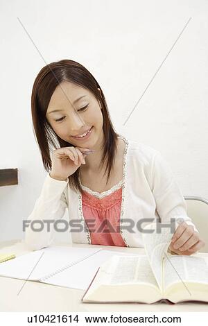 View of a young woman studying View Large Photo Image Picture - View of a young woman studying. Fotosearch